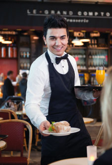 A waiter serving a customer