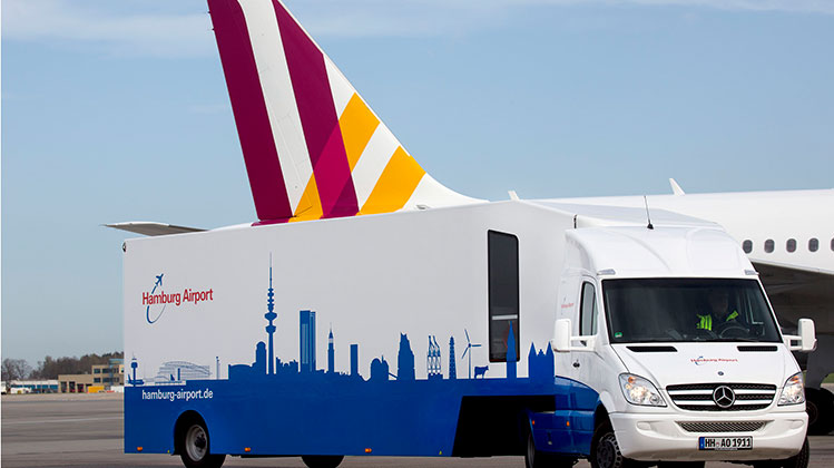The Hamburg Airport Info-Mobil is a dedicated and customised truck containing information and material to maintain a presence in the community, and at events and markets.